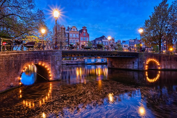 Night view of Amterdam cityscape with canal