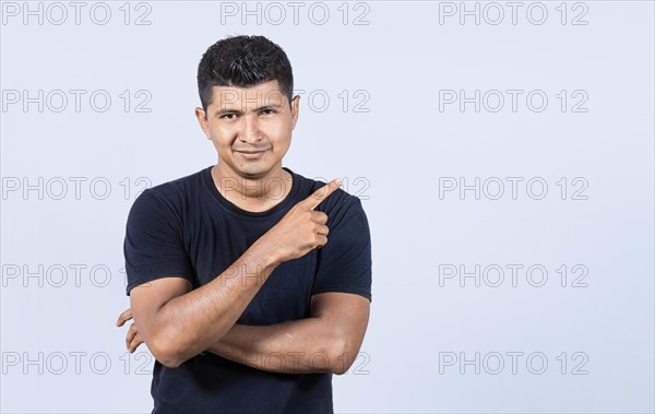 Smiling man pointing to a banner to the side