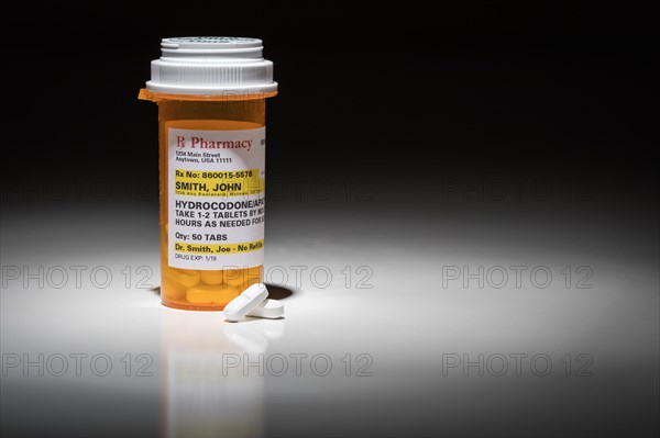 Hydrocodone pills and prescription bottle with non proprietary label. no model release required