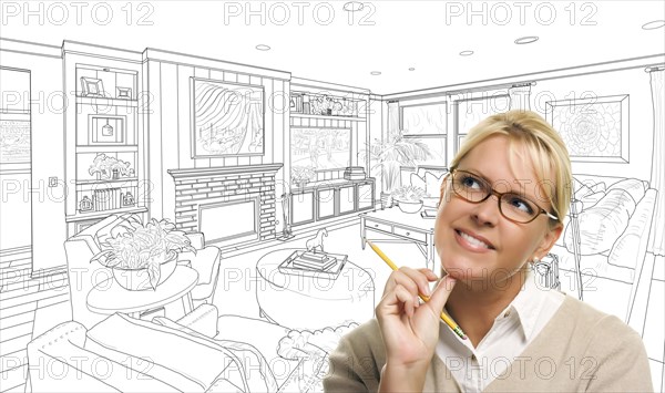 Woman with pencil over custom living room design drawing