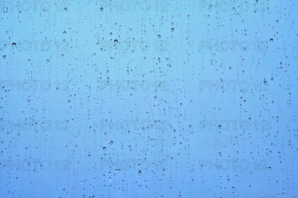 Rain water drops droplets on window glass texture background