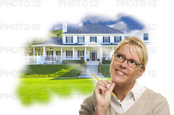 Daydreaming woman with pencil over custom house photo in thought bubble