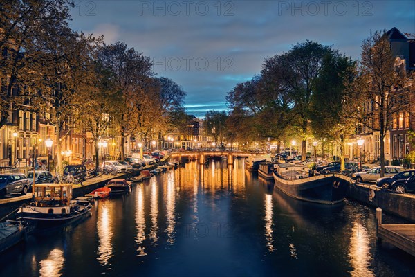 Night view of Amterdam cityscape with canal