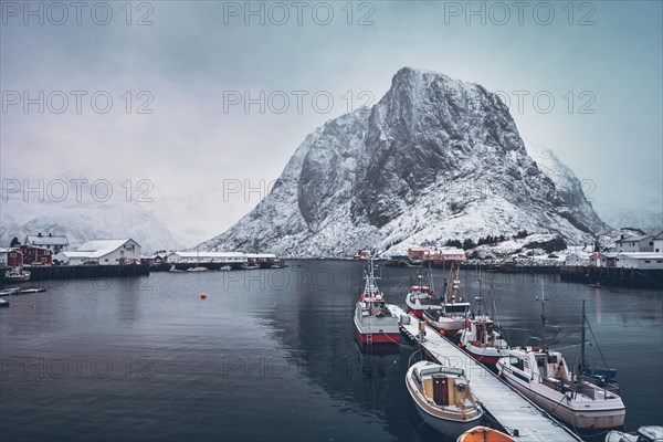 Pier with ships in Hamnoy fishing village on Lofoten Islands