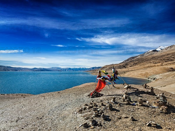 Buddhist prayer flags lungta at Himalayan lake Tso Moriri