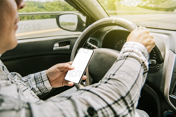 Man using his phone while driving