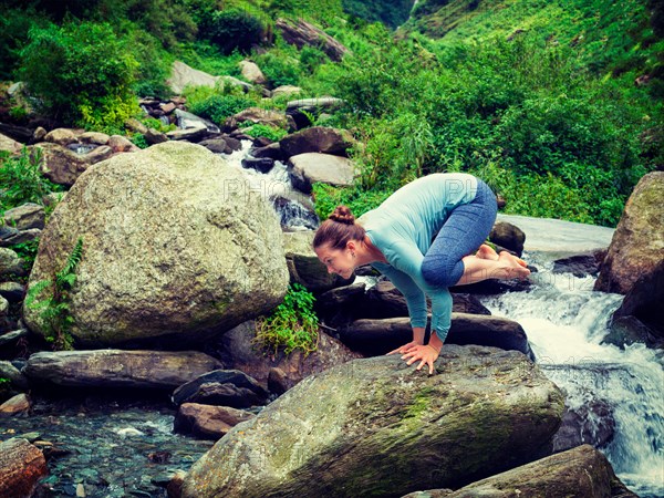 Woman doing Kakasana asana