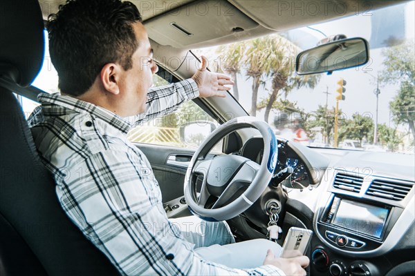 Stressed driver man yelling at other driver