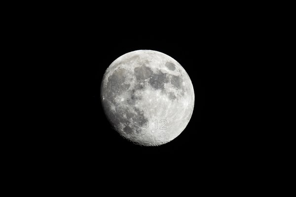 Almost full moon against A black sky shot from southern California