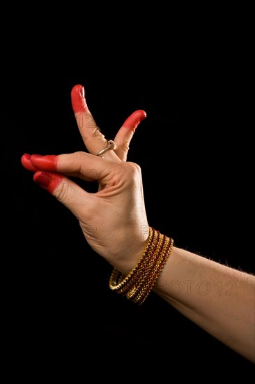 Woman hand showing Katakamukha hasta