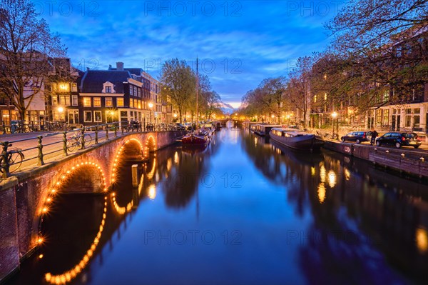 Night view of Amterdam cityscape with canal