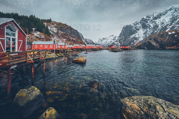 Nusfjord authentic fishing village with traditional red rorbu houses in winter. Lofoten islands