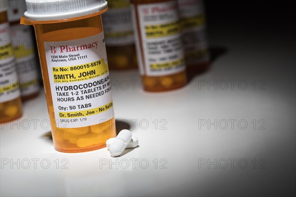 Hydrocodone pills and prescription bottles with non proprietary label. no model release required