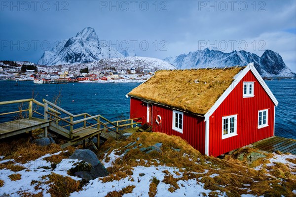 Traditional red rorbu house in Reine village on Lofoten Islands