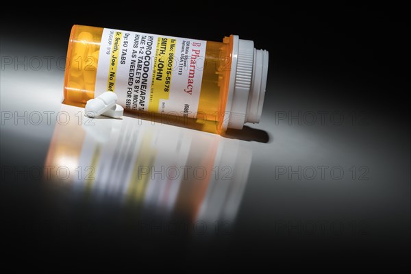 Hydrocodone pills and prescription bottle with non proprietary label. no model release required