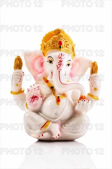 Ganesha statue isolated on white background with reflection