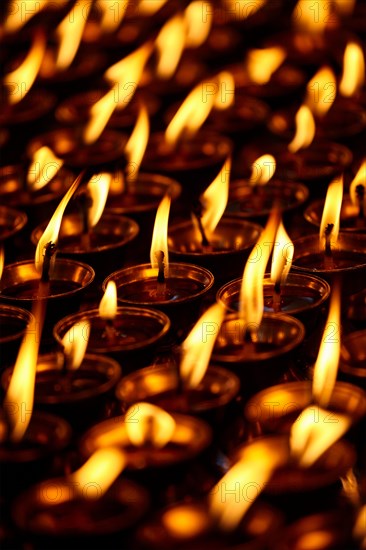 Burning candles in Buddhist temple. Dharamsala