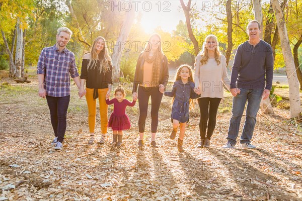 Multigenerational mixed-race family portrait outdoors