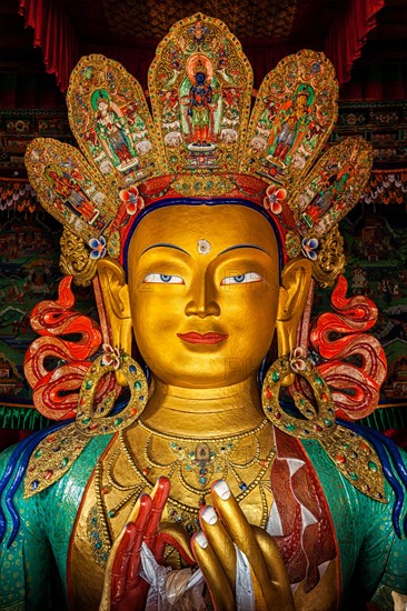 Maitreya Buddha statue face close up in Thiksey Gompa. Ladakh