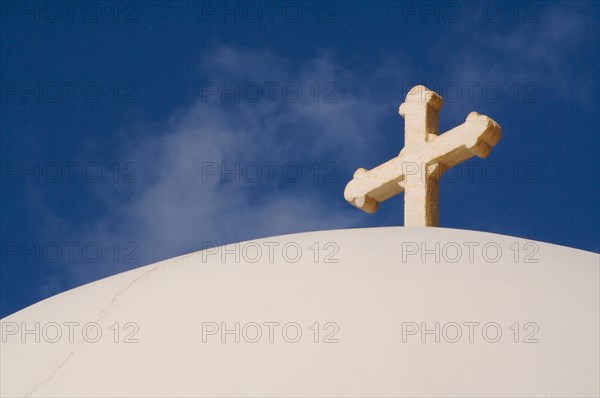 Close-up of dome and cross from santorini