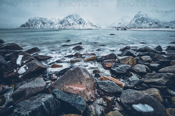 Waves and rocks on coast of Norwegian sea in fjord. Skagsanden beach