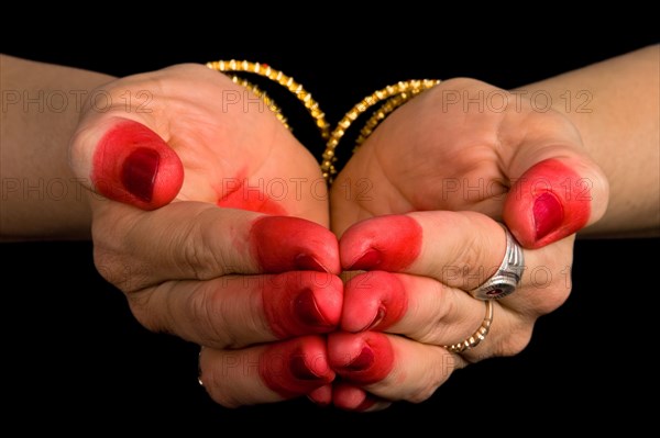 Woman hands showing Pushpaputa hasta of indian classic dance Bharata Natyam