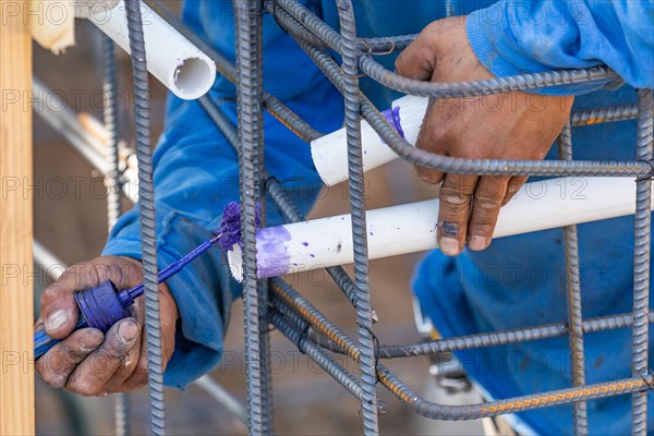 Plumber applying pipe cleaner