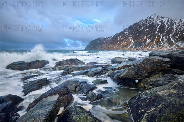 Rocky coast of fjord of Norwegian sea in winter. Lofoten islands