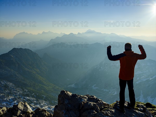 Climbers in victory pose at the summit of Krn 2. 244m