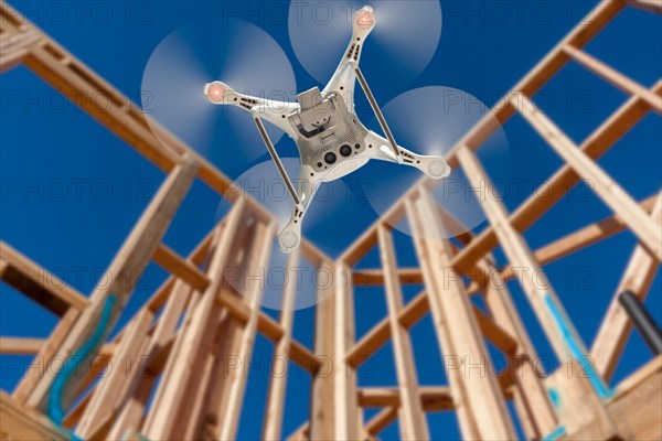 Drone quadcopter flying and inspecting construction site