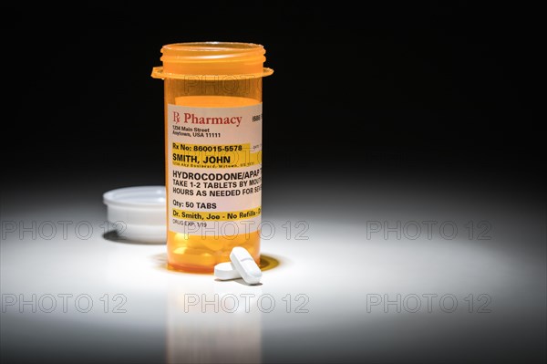 Hydrocodone pills and prescription bottle with non proprietary label. no model release required