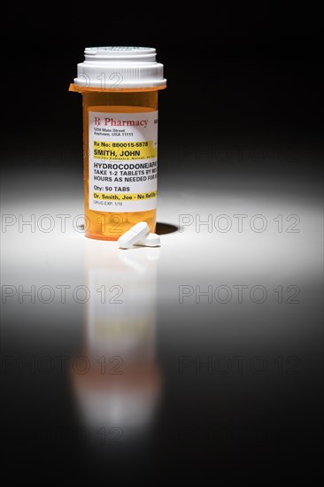 Hydrocodone pills and prescription bottle with non proprietary label. no model release required