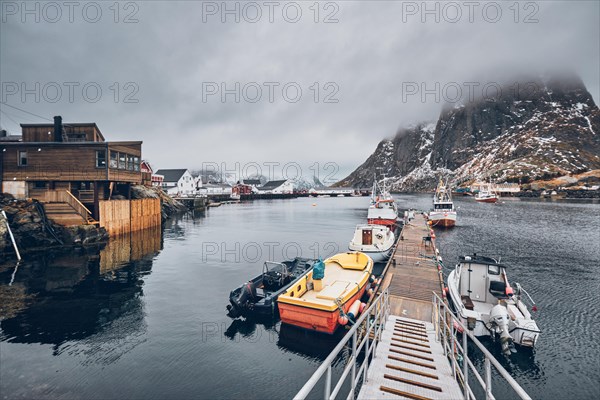 Pier with ships in Hamnoy fishing village on Lofoten Islands