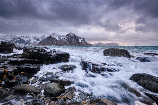 Rocky coast of fjord of Norwegian sea in winter. Vareid