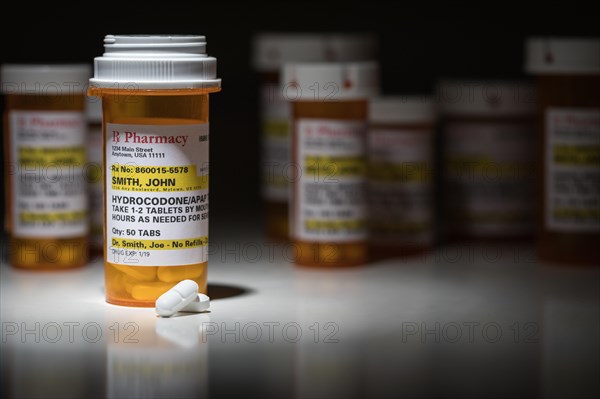 Hydrocodone pills and prescription bottles with non proprietary label. no model release required