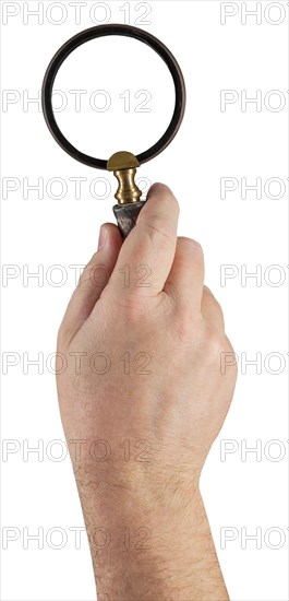 Male hand holding magifying glass isolated on a white background