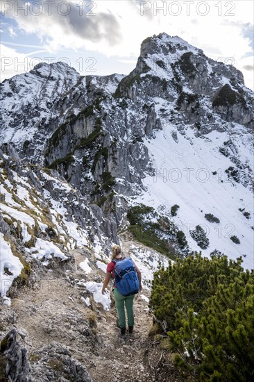 Young female hiker on hiking trail to Kramerspitz