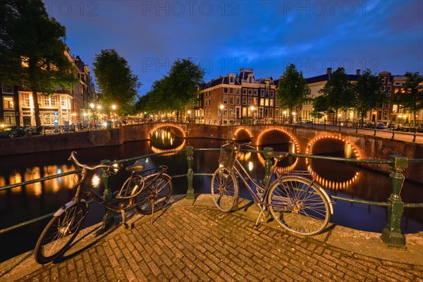 Night view of Amterdam cityscape with canal