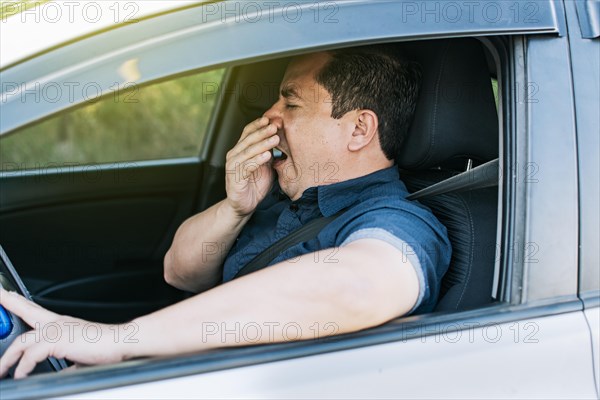 Tired driver yawning