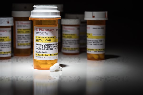 Hydrocodone pills and prescription bottles with non proprietary label. no model release required