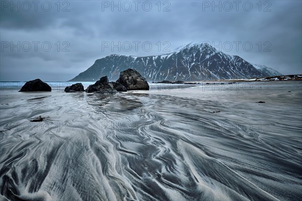 Rocky coast of fjord of Norwegian sea in winter. Skagsanden beach