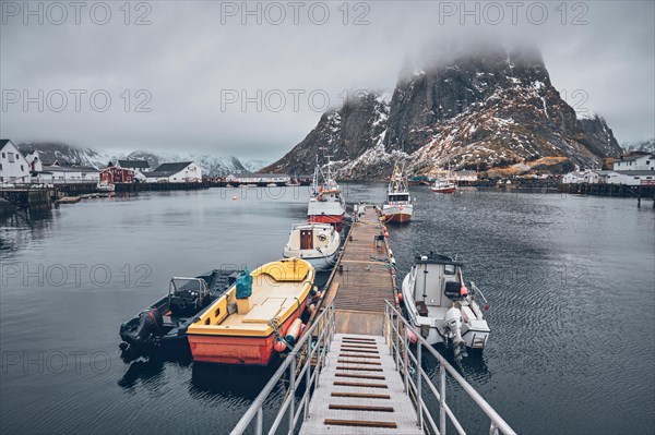 Pier with ships in Hamnoy fishing village on Lofoten Islands