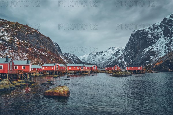 Nusfjord authentic fishing village with traditional red rorbu houses in winter. Lofoten islands