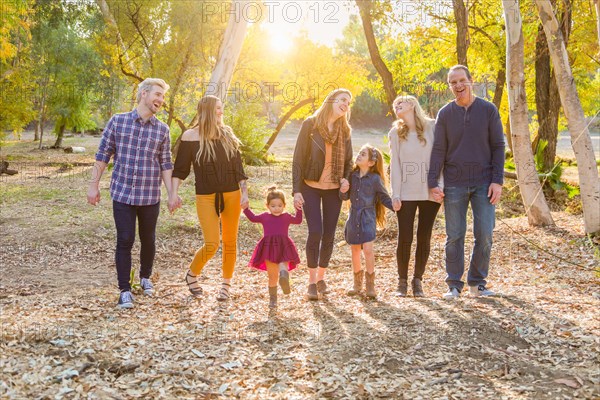 Multigenerational mixed-race family portrait outdoors
