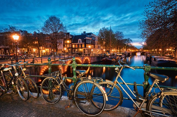 Night view of Amterdam cityscape with canal