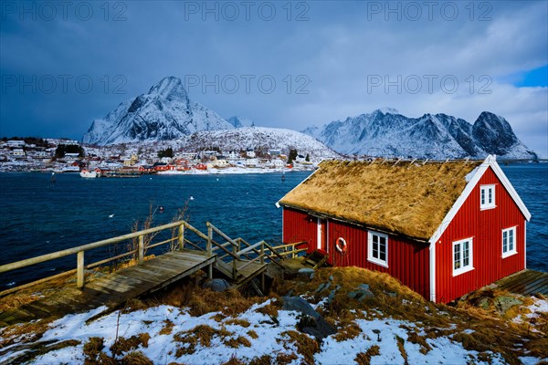 Traditional red rorbu house in Reine village on Lofoten Islands