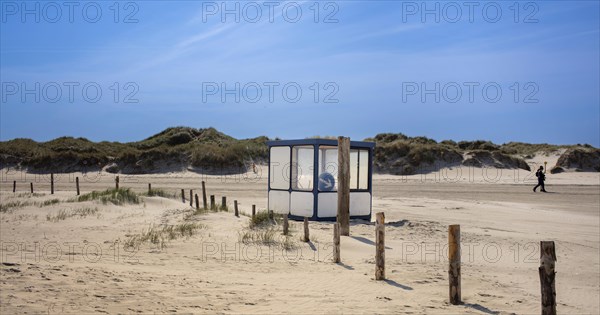 Beach with wooden planks and guard house