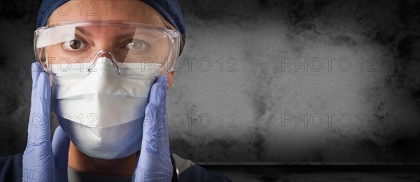 Female doctor or nurse wearing goggles