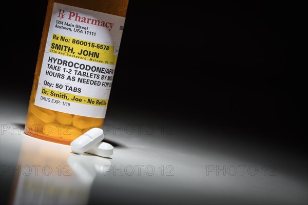 Hydrocodone pills and prescription bottle with non proprietary label. no model release required