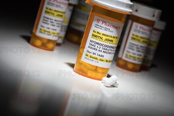 Hydrocodone pills and prescription bottles with non proprietary label. no model release required